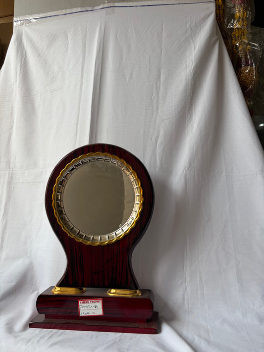 JH 231 A dark wood circular decorative plaques featuring a gold metal trim and a polished pedestal base for formal awards.