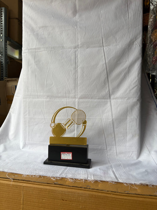 Gold table tennis trophies featuring a ping pong paddle and ball silhouette on a sleek black base by Meru Trophy.